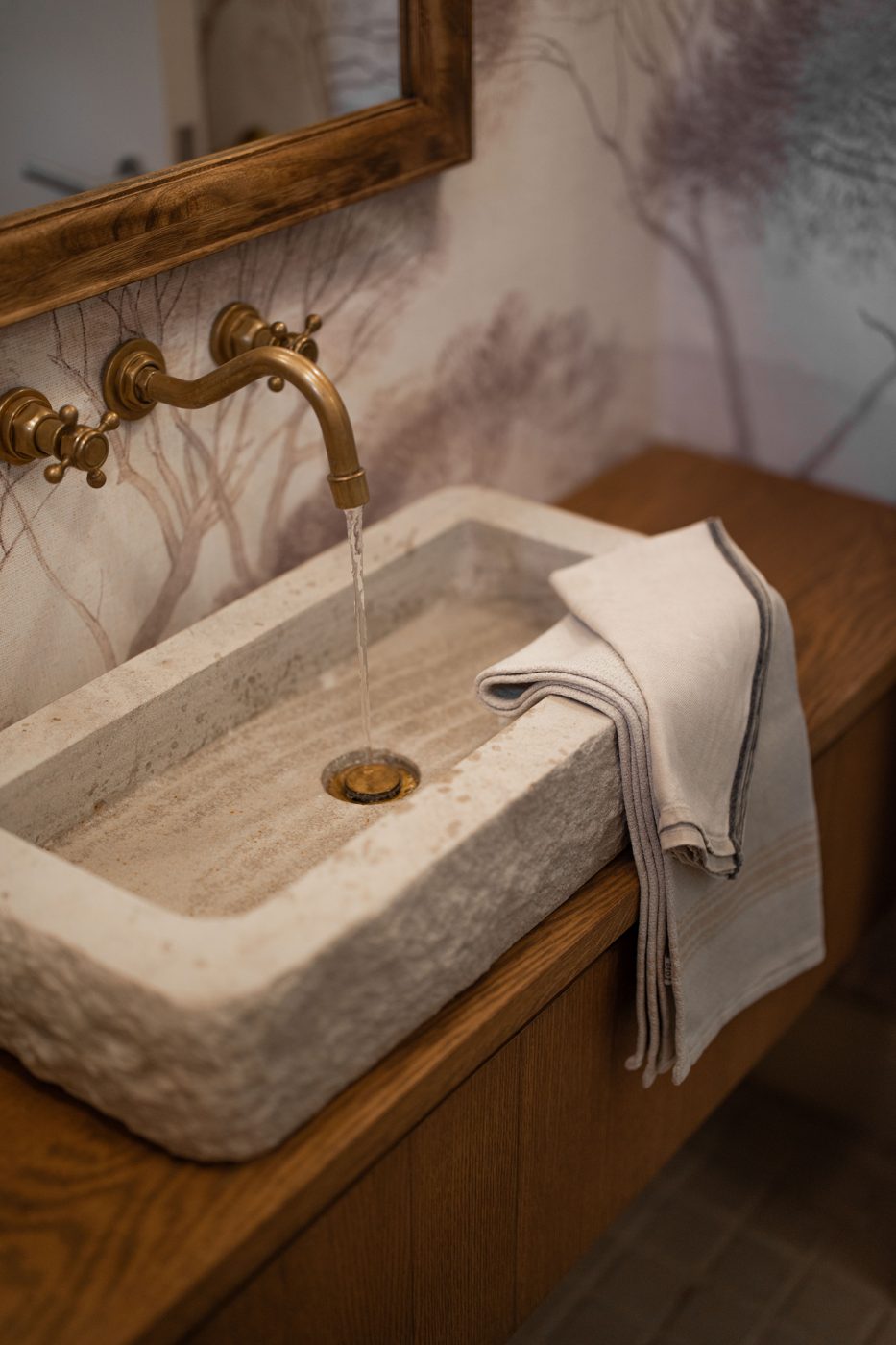 Bathroom with sandstone freestanding bath in a Franschhoek home