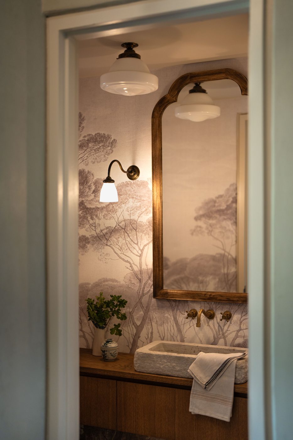 Hallway with arched niche and hand applied plaster walls