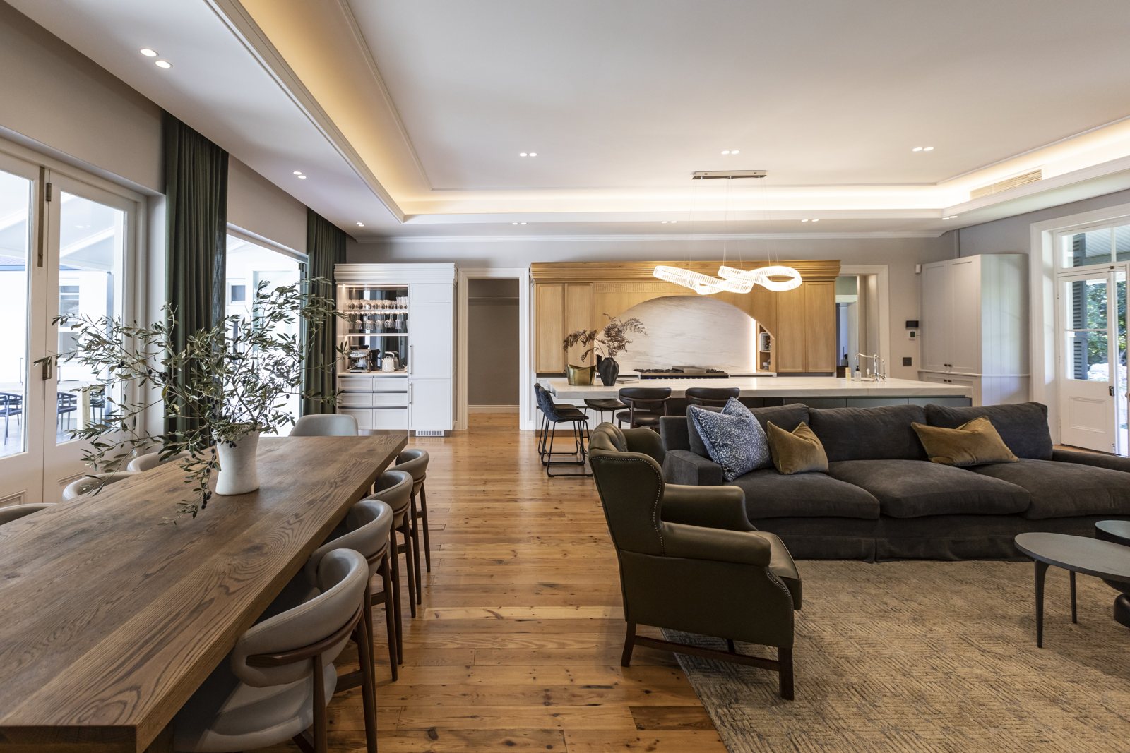 Open plan living and dining with timber ceiling at Zion, Paarl